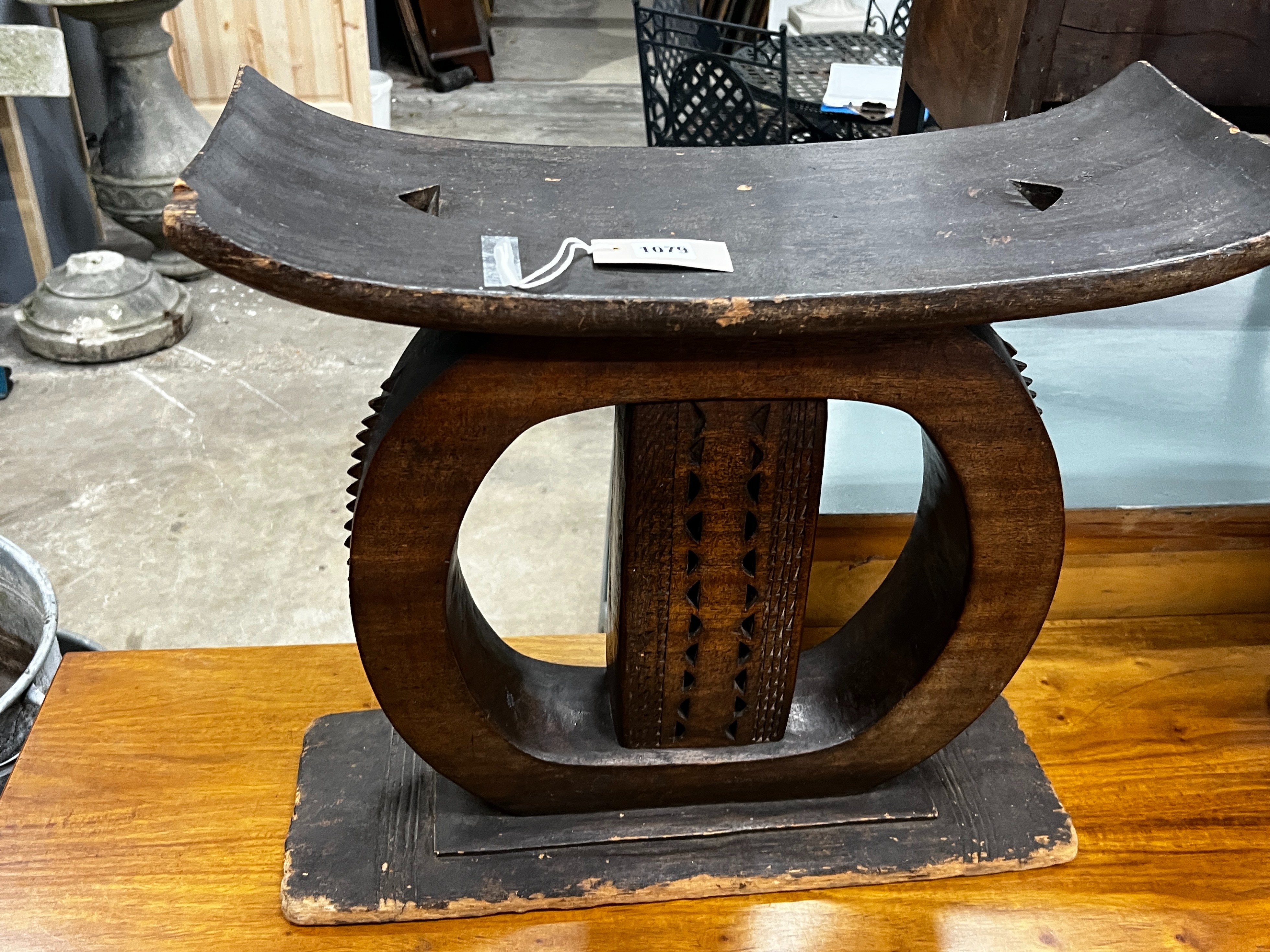 Two African chip carved stools, larger width 56cm, height 47cm